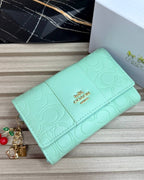 BILLETERA MEDIANA COACH EMBOSSED LOGO EDITION